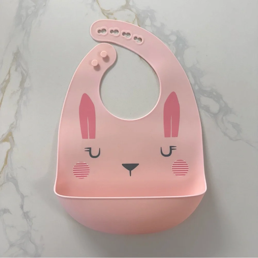 Three Silicone Baby Plates and one Pink Bib